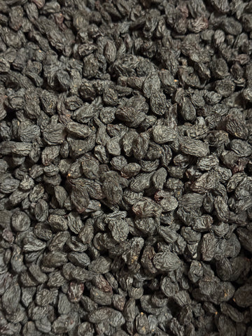 Close-up of sun-dried Afghan black raisins (kali kishmish) from Ghafori Foods