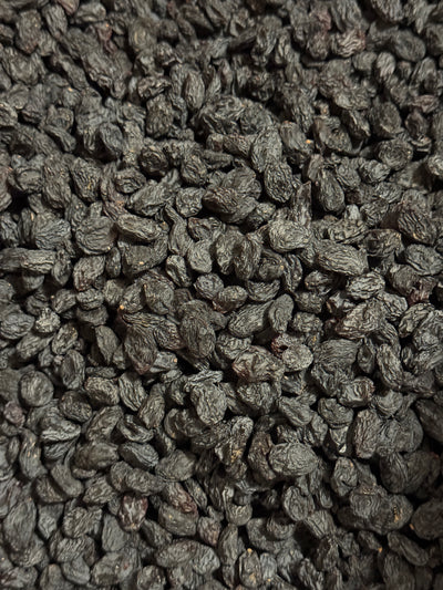 Close-up of sun-dried Afghan black raisins (kali kishmish) from Ghafori Foods