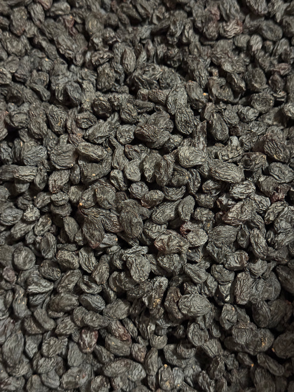 Close-up of sun-dried Afghan black raisins (kali kishmish) from Ghafori Foods