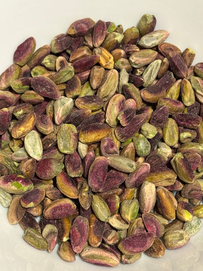 A white bowl of raw, shelled pistachio kernels from Afghanistan — Ghafori Foods