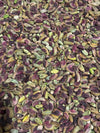 Close-up of shelled Afghan pistachios (pista giri) showing natural purple-to-green skins — Ghafori Foods