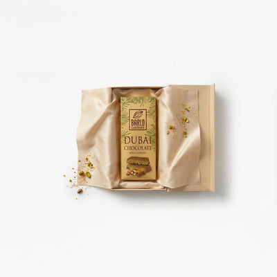 Barlo Dubai Chocolate with Pistachio bar presented in a gift box with gold satin and pistachios — Ghafori Foods