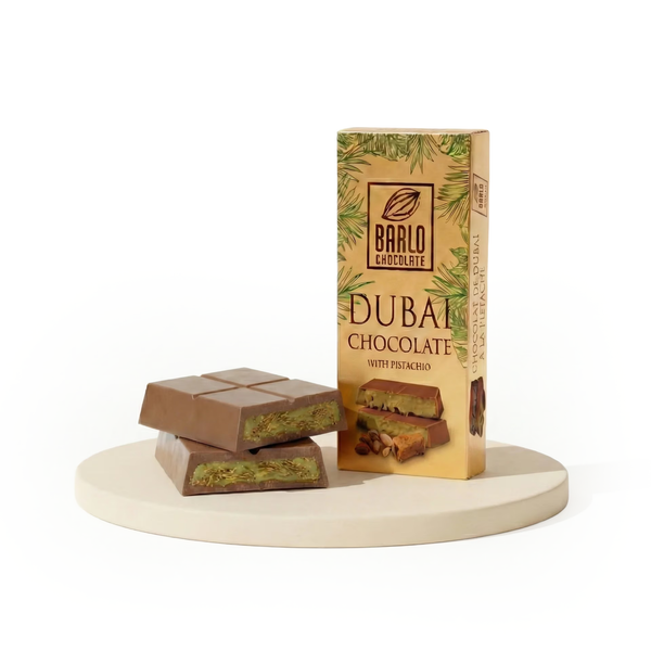 Barlo Dubai Chocolate with Pistachio 100g bar and gold box, with squares cut to show the green pistachio and kadayif filling — Ghafori Foods