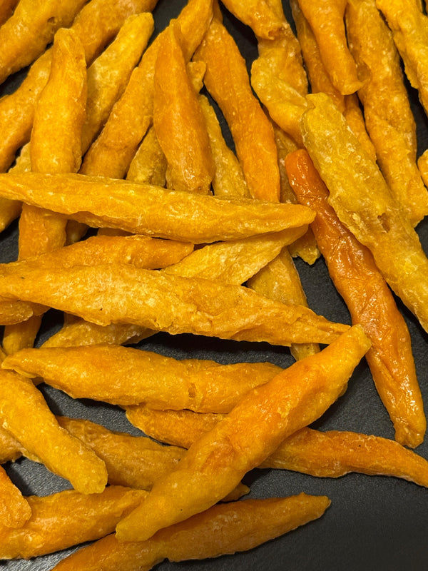 Close-up of Chapaneemak rolled apricots showing the dense, chewy sun-dried texture