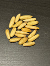 Ivory chilgoza pine nut kernels cracked from the shell, ready to eat